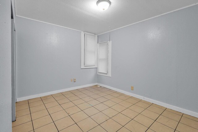 4470 N 37th St, Milwaukee, WI 53209 - unfurnished room with a textured ceiling and baseboards