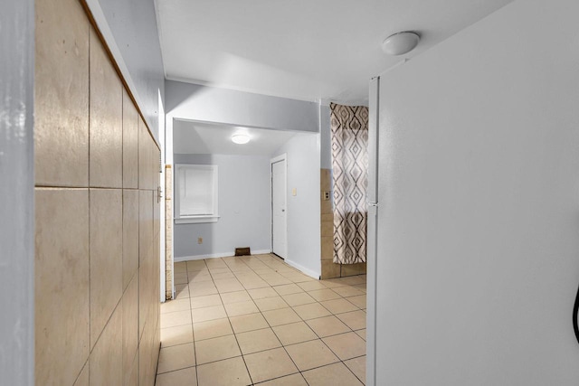 corridor with light tile patterned floors