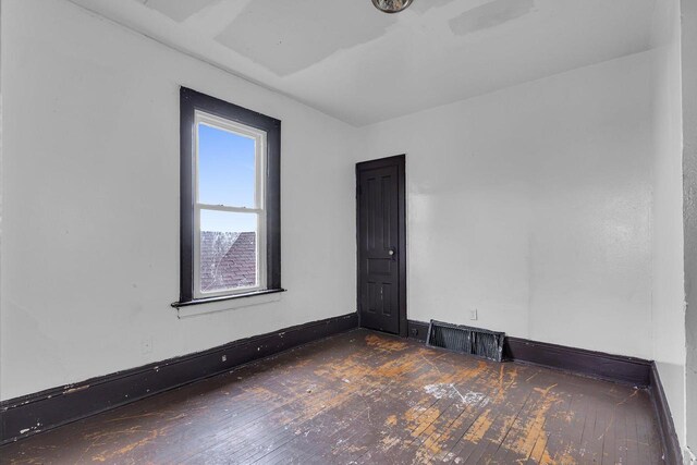 empty room featuring dark hardwood / wood-style floors