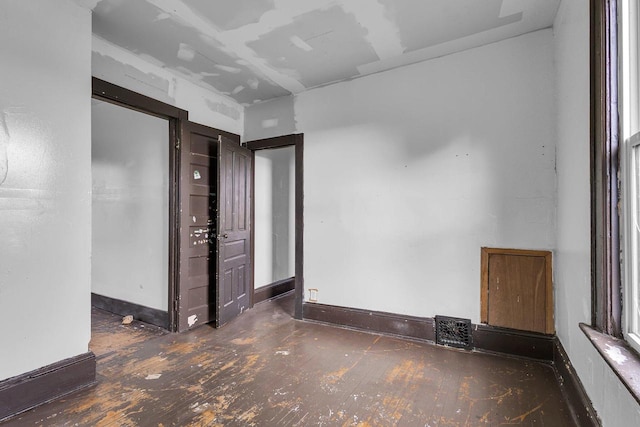 empty room featuring dark hardwood / wood-style floors