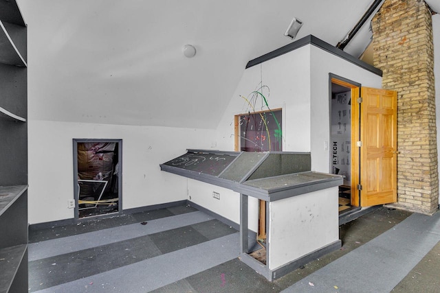 interior space featuring lofted ceiling with beams