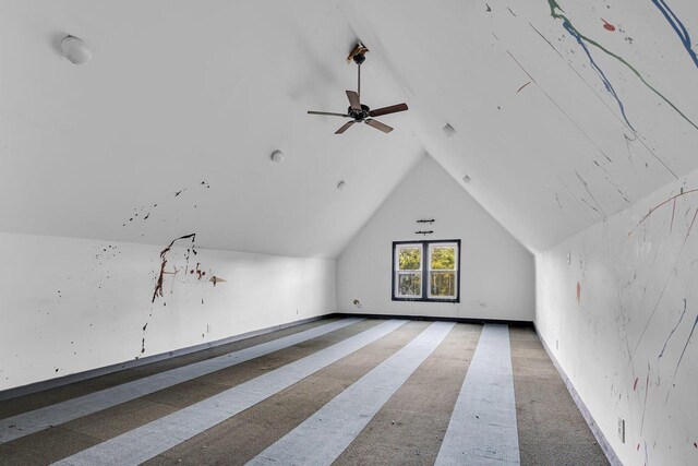 bonus room featuring ceiling fan, lofted ceiling, and carpet flooring