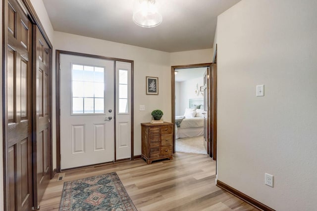 foyer with light hardwood / wood-style flooring