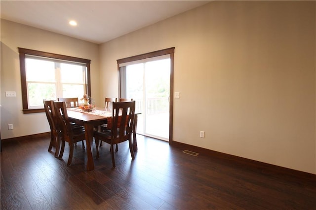 dining area featuring dark hardwood / wood-style floors