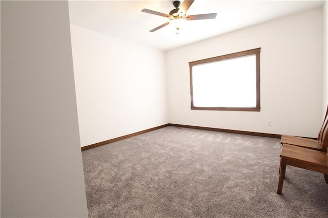 spare room with ceiling fan and carpet floors