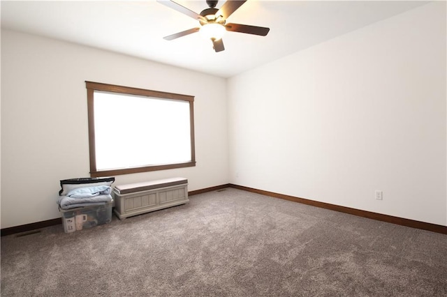 unfurnished room with carpet floors and ceiling fan