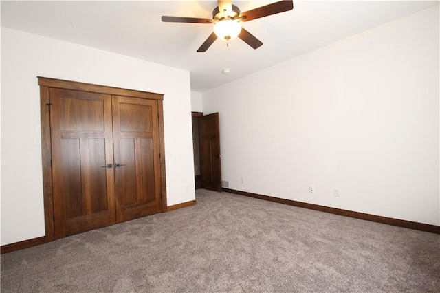 unfurnished bedroom with ceiling fan and light carpet