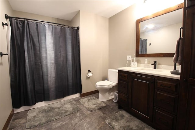 bathroom with walk in shower, vanity, and toilet