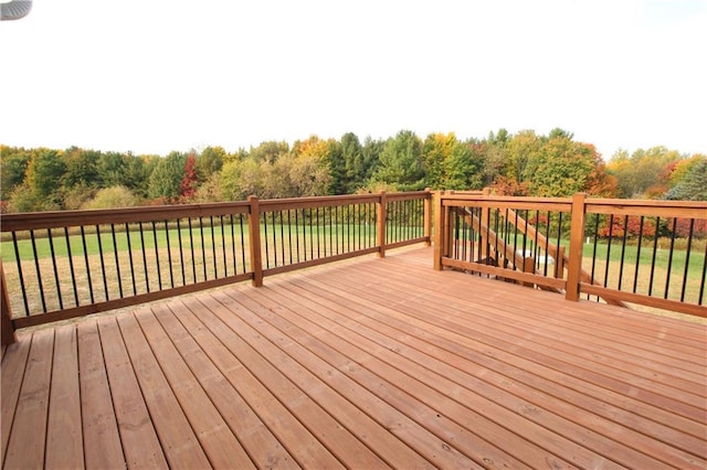 wooden terrace with a yard