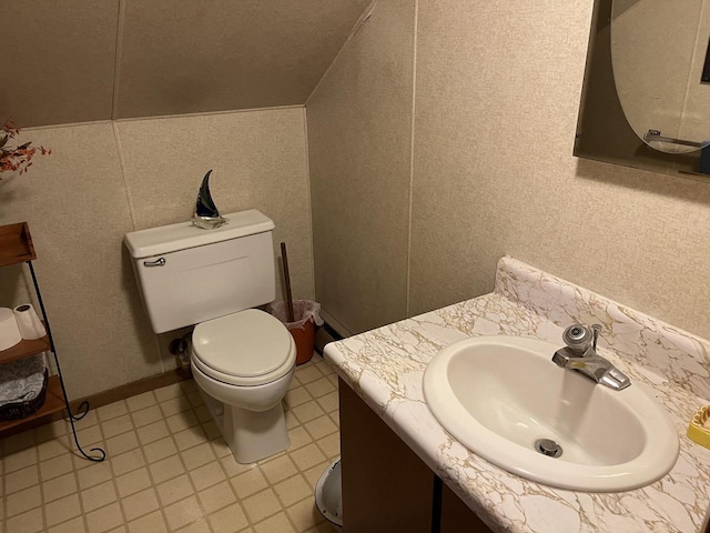 W6011 Pike River Rd, Wausaukee, WI 54177 - bathroom featuring toilet, vanity, and lofted ceiling