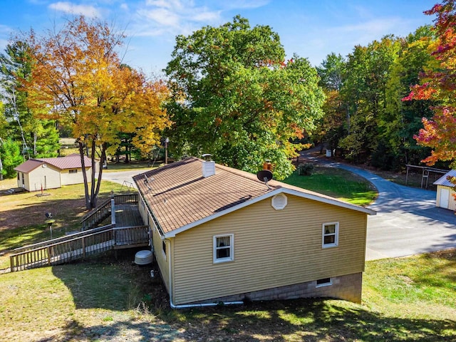 view of home's exterior with a lawn