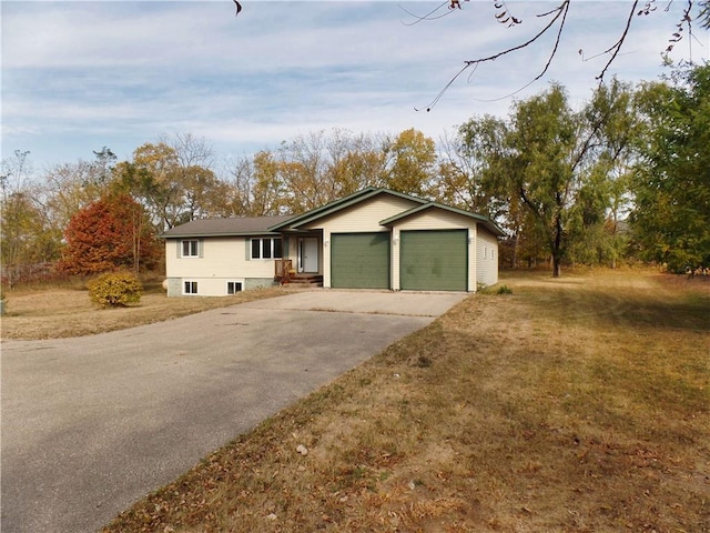 single story home with a front lawn and a garage