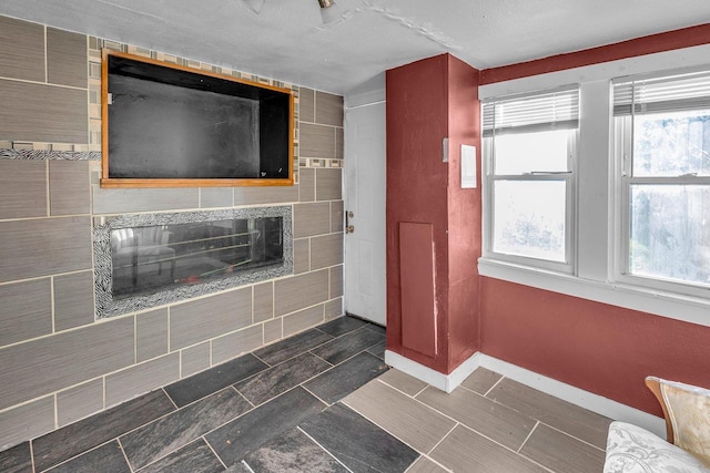 bathroom featuring a tile fireplace