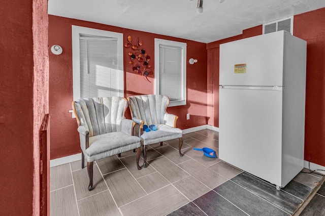 living area featuring tile patterned flooring