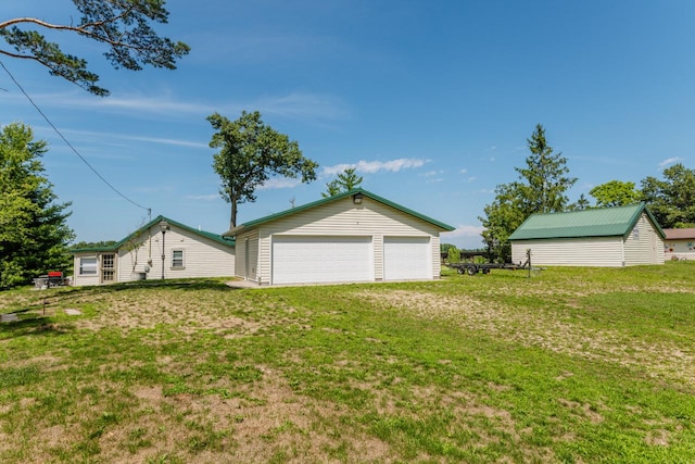 garage with a lawn