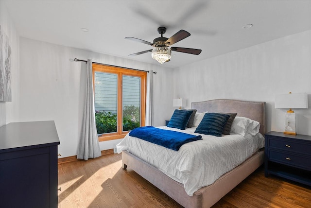 bedroom featuring light hardwood / wood-style flooring and ceiling fan