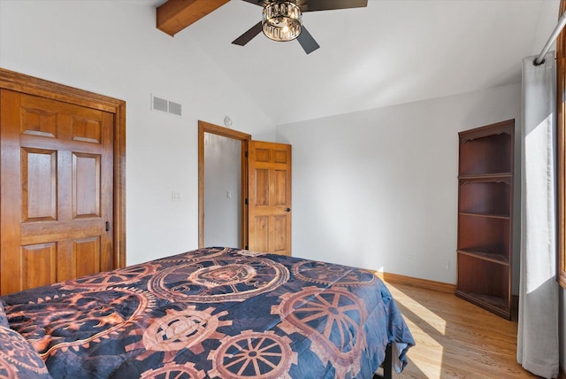 bedroom featuring beamed ceiling, high vaulted ceiling, light hardwood / wood-style flooring, and ceiling fan