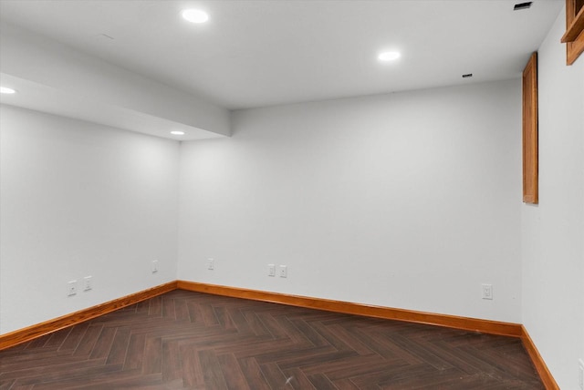 basement with dark parquet floors