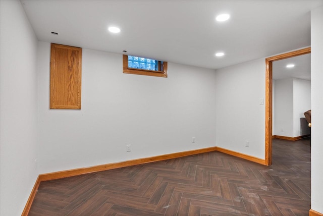 basement featuring dark parquet floors