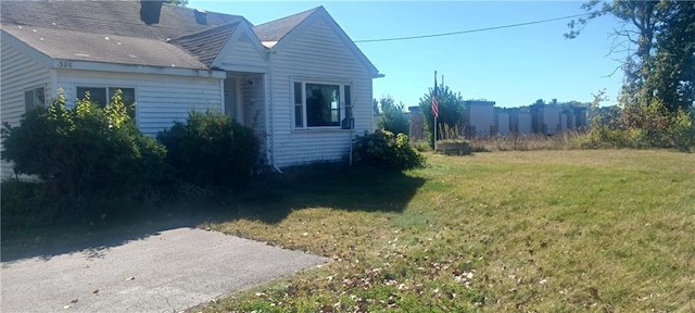 view of home's exterior featuring a yard