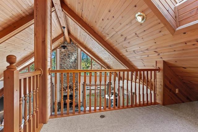 additional living space with wood ceiling, plenty of natural light, carpet, and lofted ceiling with beams