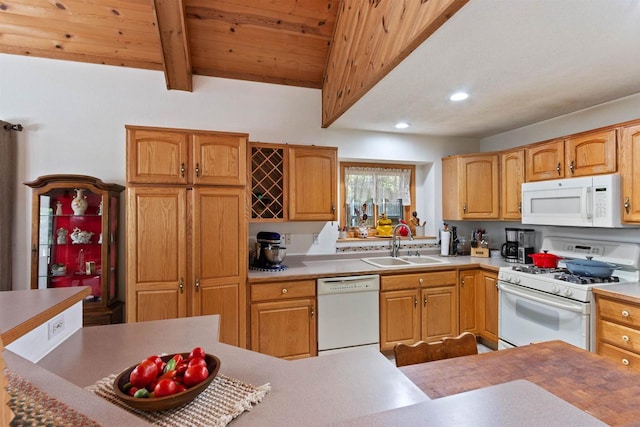 kitchen featuring white appliances, lofted ceiling with beams, and sink