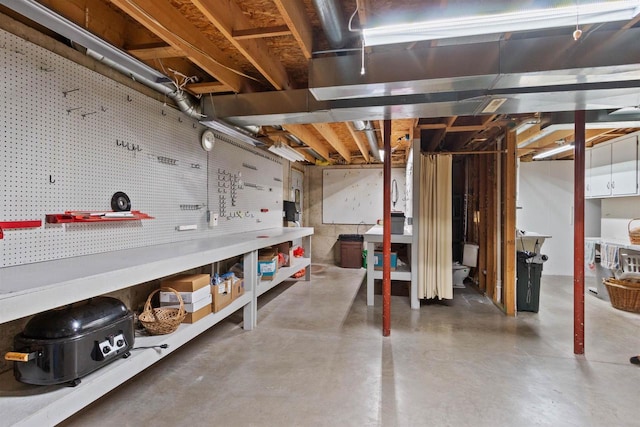 basement with a workshop area