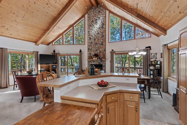 kitchen featuring high vaulted ceiling, beamed ceiling, wooden ceiling, and light colored carpet