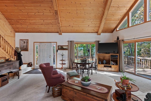 carpeted living room featuring wood ceiling, beamed ceiling, high vaulted ceiling, and a healthy amount of sunlight