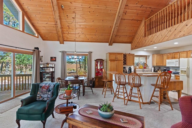 331 Robindale Ct, Nekoosa, WI 54457 - living room with high vaulted ceiling, light carpet, beamed ceiling, wooden ceiling, and healthy amount of natural light