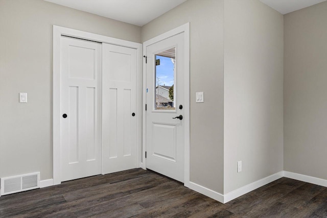 entrance foyer featuring dark hardwood / wood-style flooring