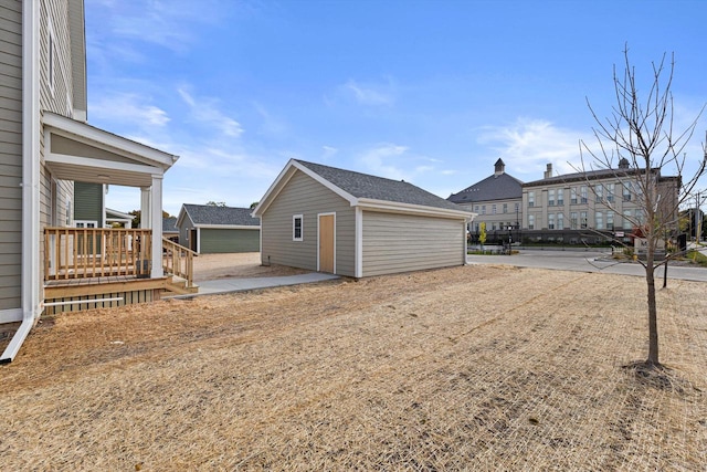 exterior space with an outdoor structure and a patio