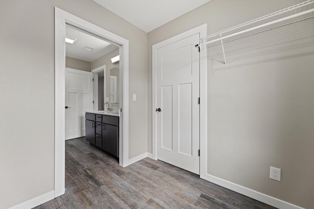 interior space with hardwood / wood-style floors and vanity