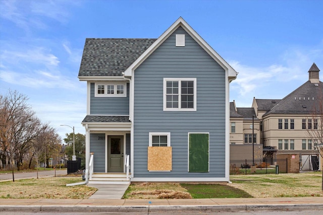 view of front of home with a front lawn