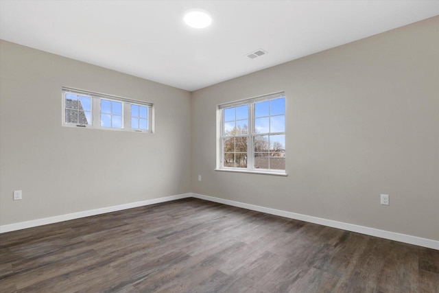 empty room featuring dark hardwood / wood-style floors