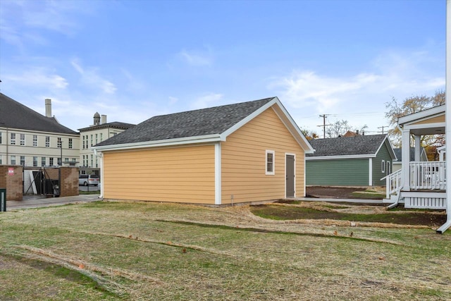 view of side of home featuring a yard