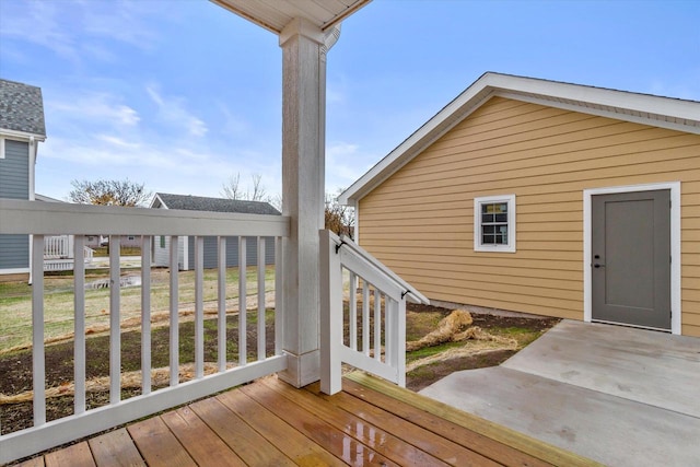 wooden deck featuring a yard