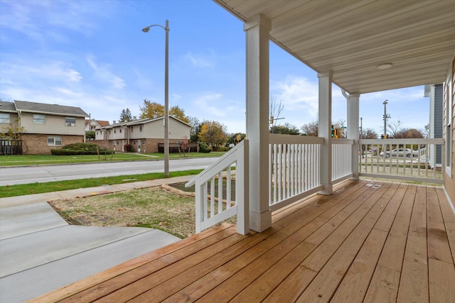 wooden terrace featuring covered porch