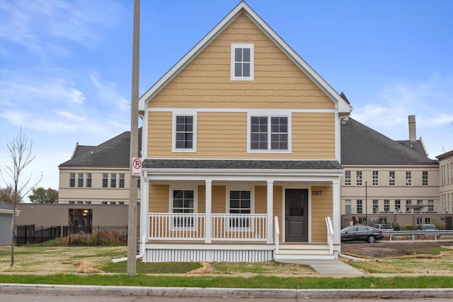 front facade featuring a porch and a front yard