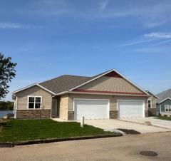 view of front of home with a front yard and a garage