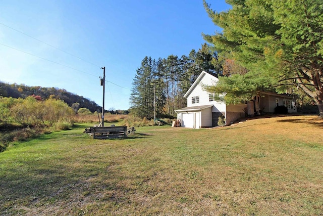 view of yard featuring a garage