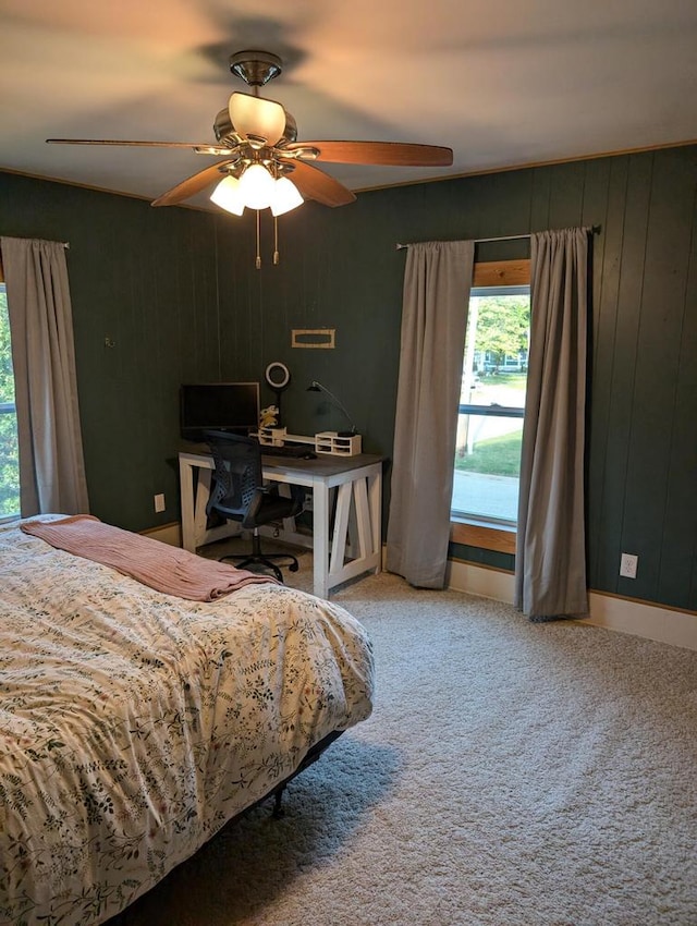 bedroom with ceiling fan and carpet floors