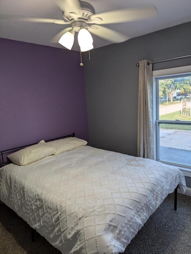 carpeted bedroom with ceiling fan