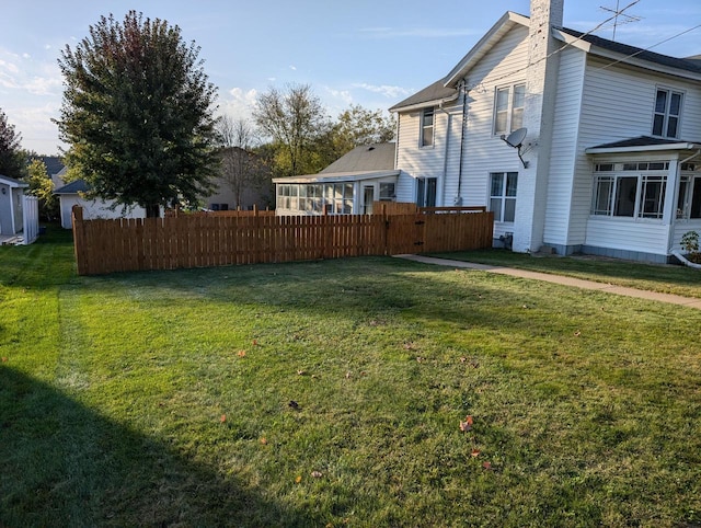 view of yard featuring a sunroom