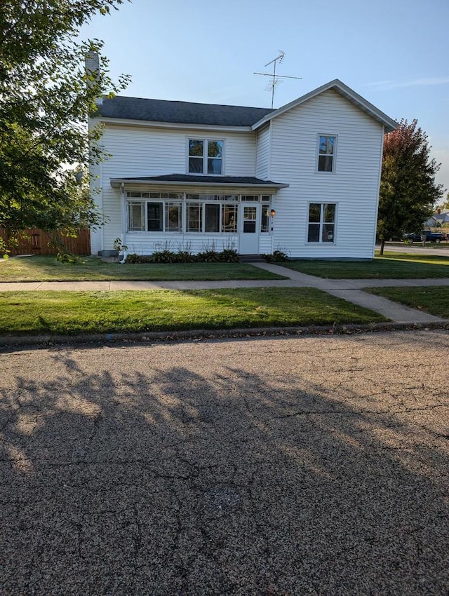 view of front of property with a front lawn