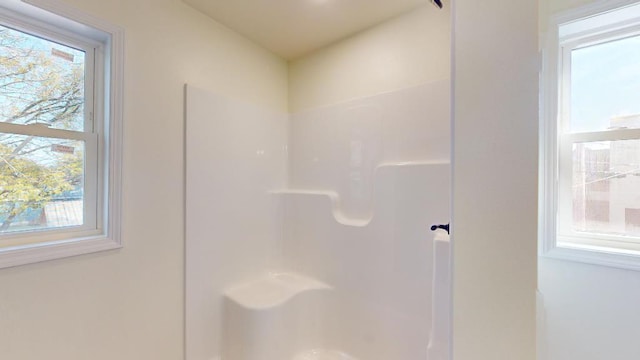 bathroom featuring walk in shower