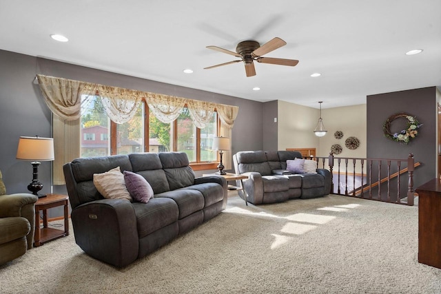 living room featuring carpet floors and ceiling fan