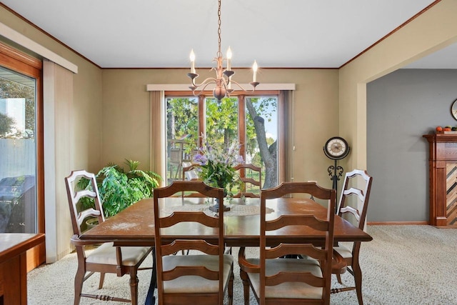 carpeted dining room featuring crown molding, a chandelier, and a wealth of natural light