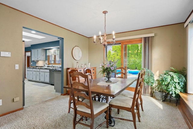 carpeted dining area with crown molding and an inviting chandelier