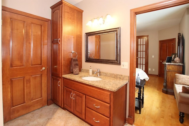 bathroom with vanity and hardwood / wood-style flooring